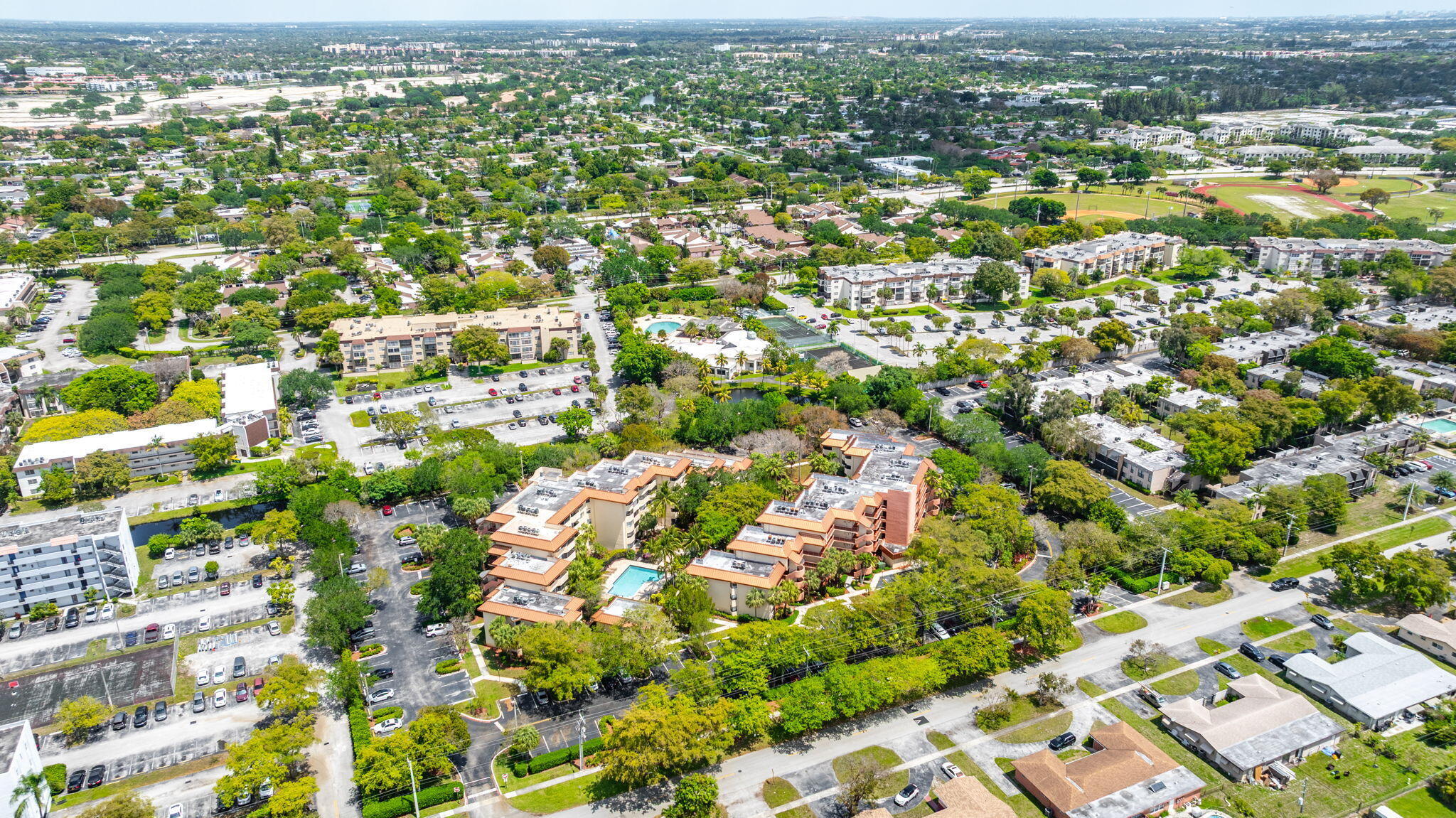 7451 Northwest 16th Street, Unit 303 Plantation, FL 33313 - Photo 38 of 41 an aerial view of residential houses with outdoor space and trees