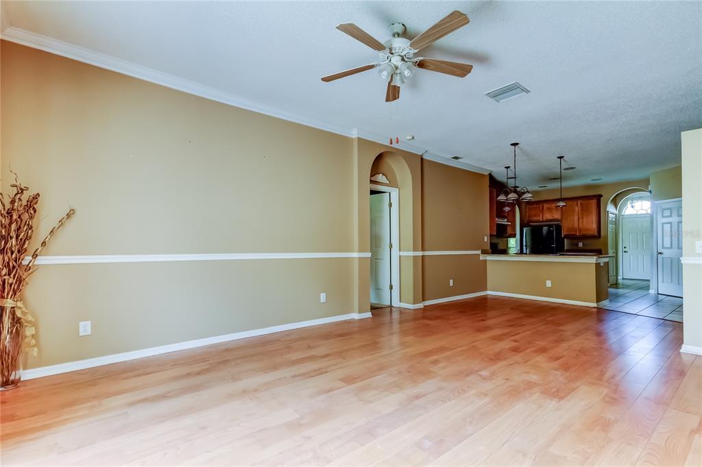 10708 Northridge Court Trinity, FL 34655 - Photo 13 of 58 a view of an empty room with wooden floor