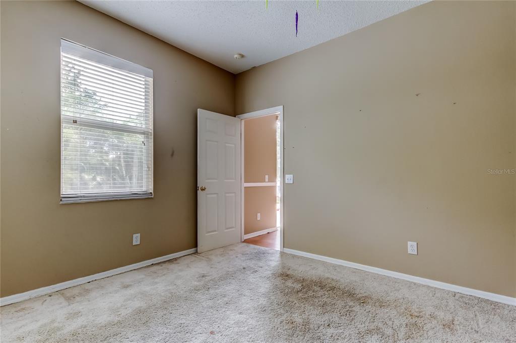 10708 Northridge Court Trinity, FL 34655 - Photo 26 of 59 an empty room with windows
