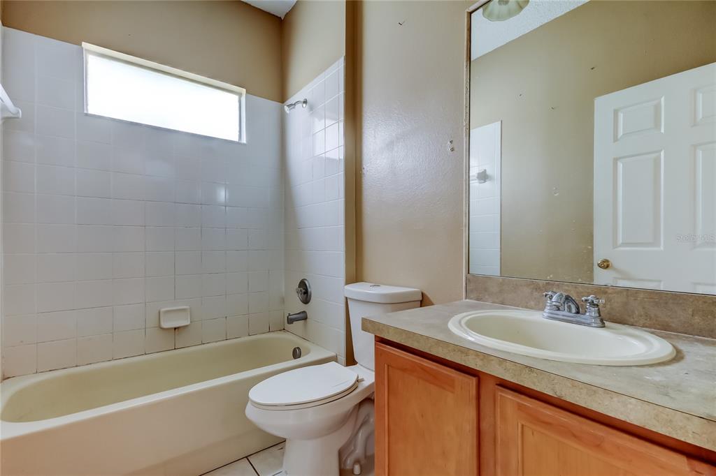 10708 Northridge Court Trinity, FL 34655 - Photo 28 of 58 a bathroom with a sink and a mirror