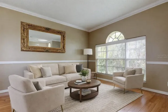 an empty room with a window and a ceiling fan