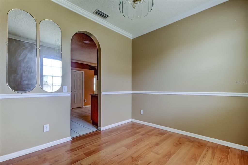 10708 Northridge Court Trinity, FL 34655 - Photo 35 of 58 a view of empty room with wooden floor and fan
