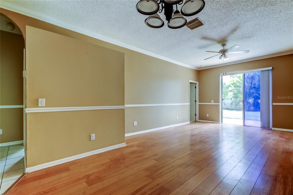 10708 Northridge Court Trinity, FL 34655 - Photo 45 of 58 a view of an empty room with a window and wooden floor