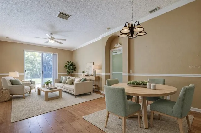 a kitchen with stainless steel appliances granite countertop a sink and a wooden cabinets