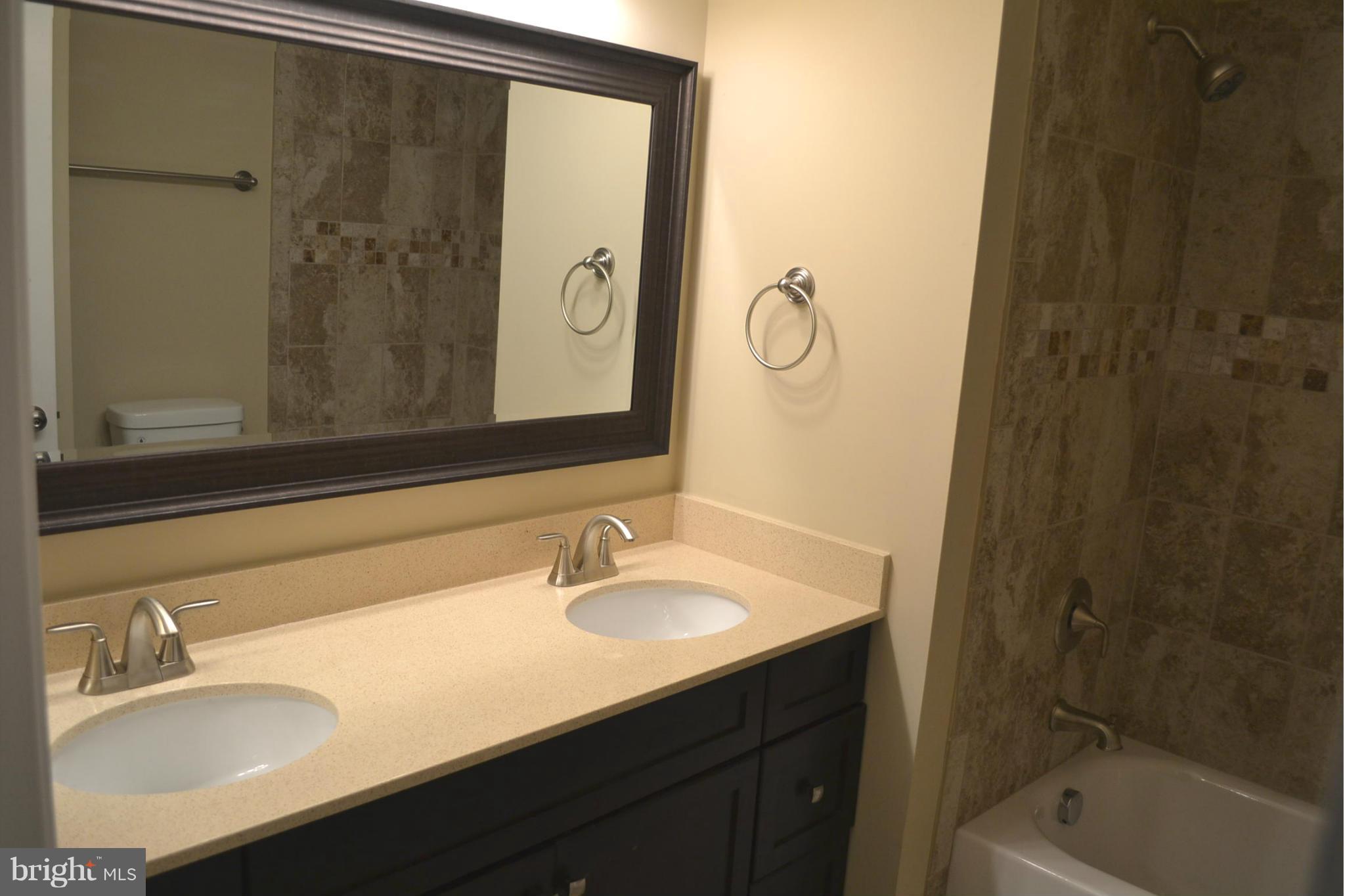 7706 Hickory Glen Way Springfield, VA 22153 - Photo 11 of 21 a bathroom with a sink and a mirror