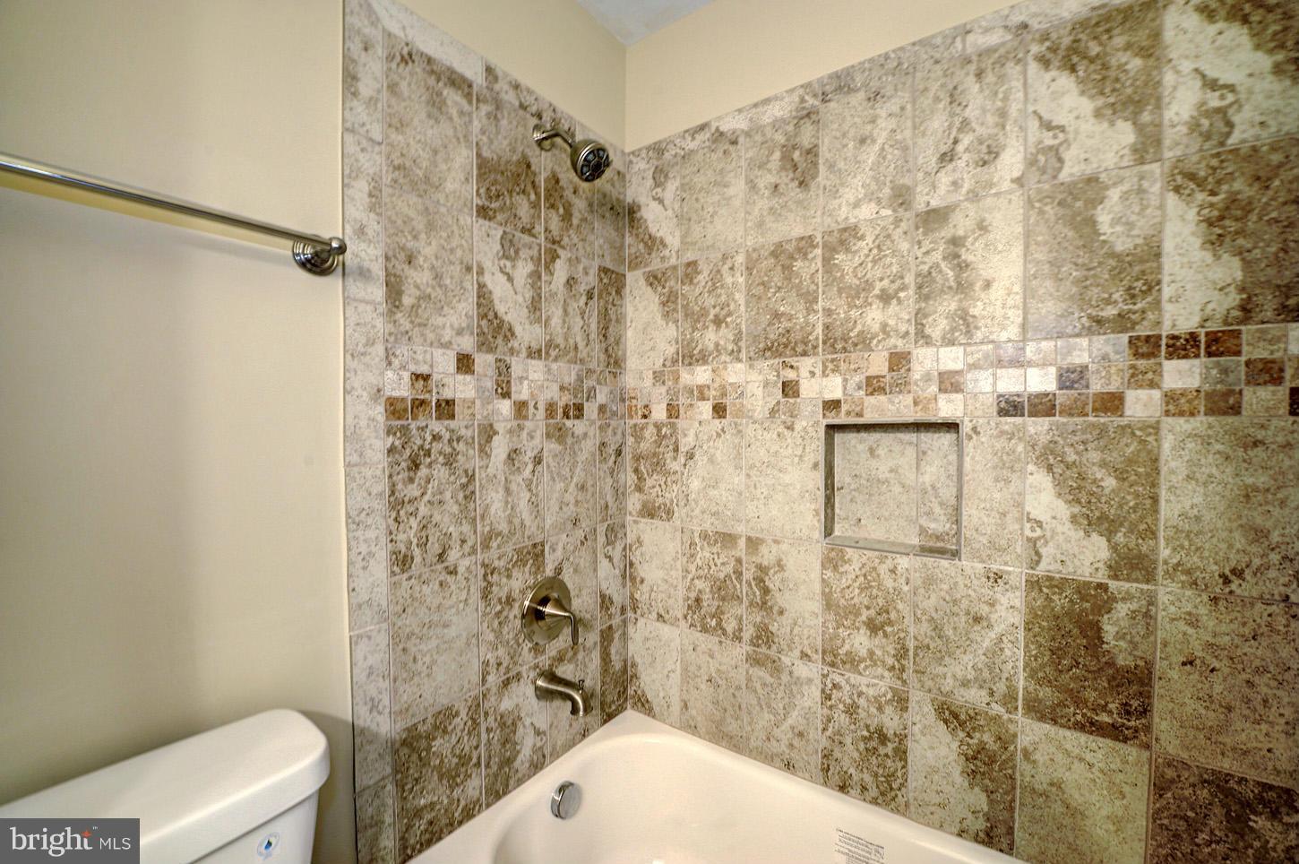 7706 Hickory Glen Way Springfield, VA 22153 - Photo 14 of 21 a bathroom with a toilet and shower