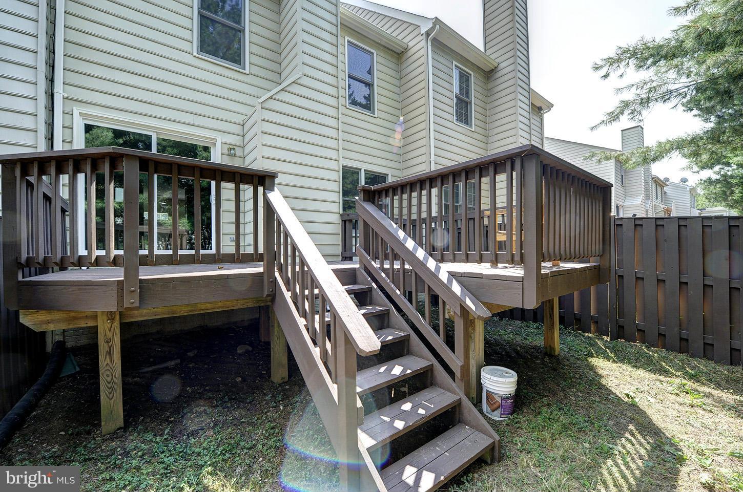 7706 Hickory Glen Way Springfield, VA 22153 - Photo 20 of 21 a front view of a house with a deck