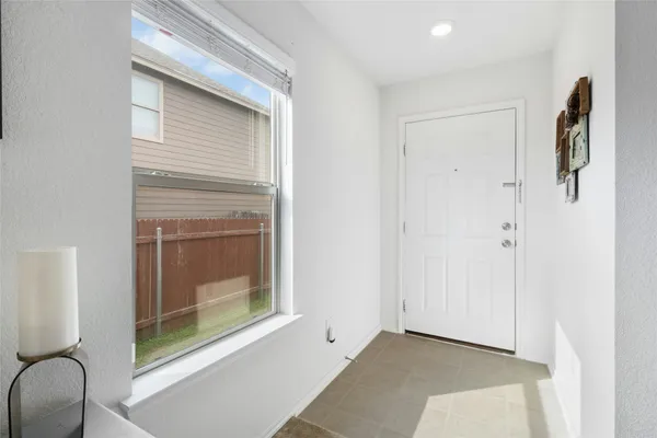 a view of livingroom with furniture cabinet and window