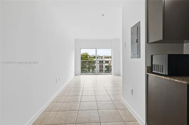 a view of an empty room and window