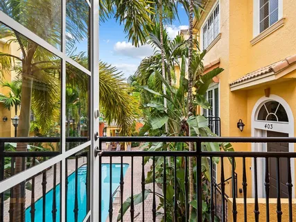 a view of a small yard from a balcony