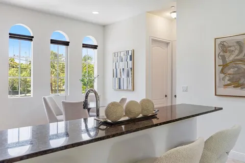 a dining room with furniture and wooden floor