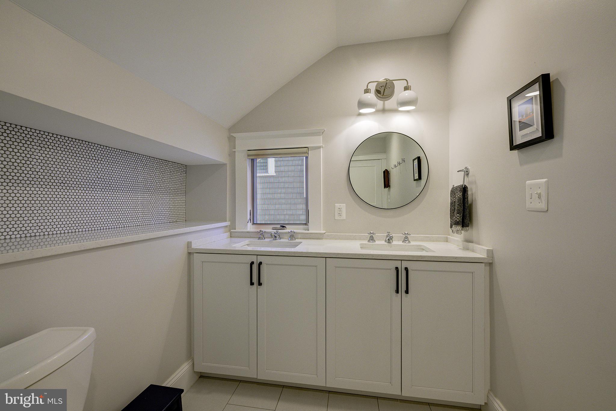 5710 Broad Branch Road Northwest Washington, DC 20015 - Photo 14 of 25 a bathroom with a sink and a mirror