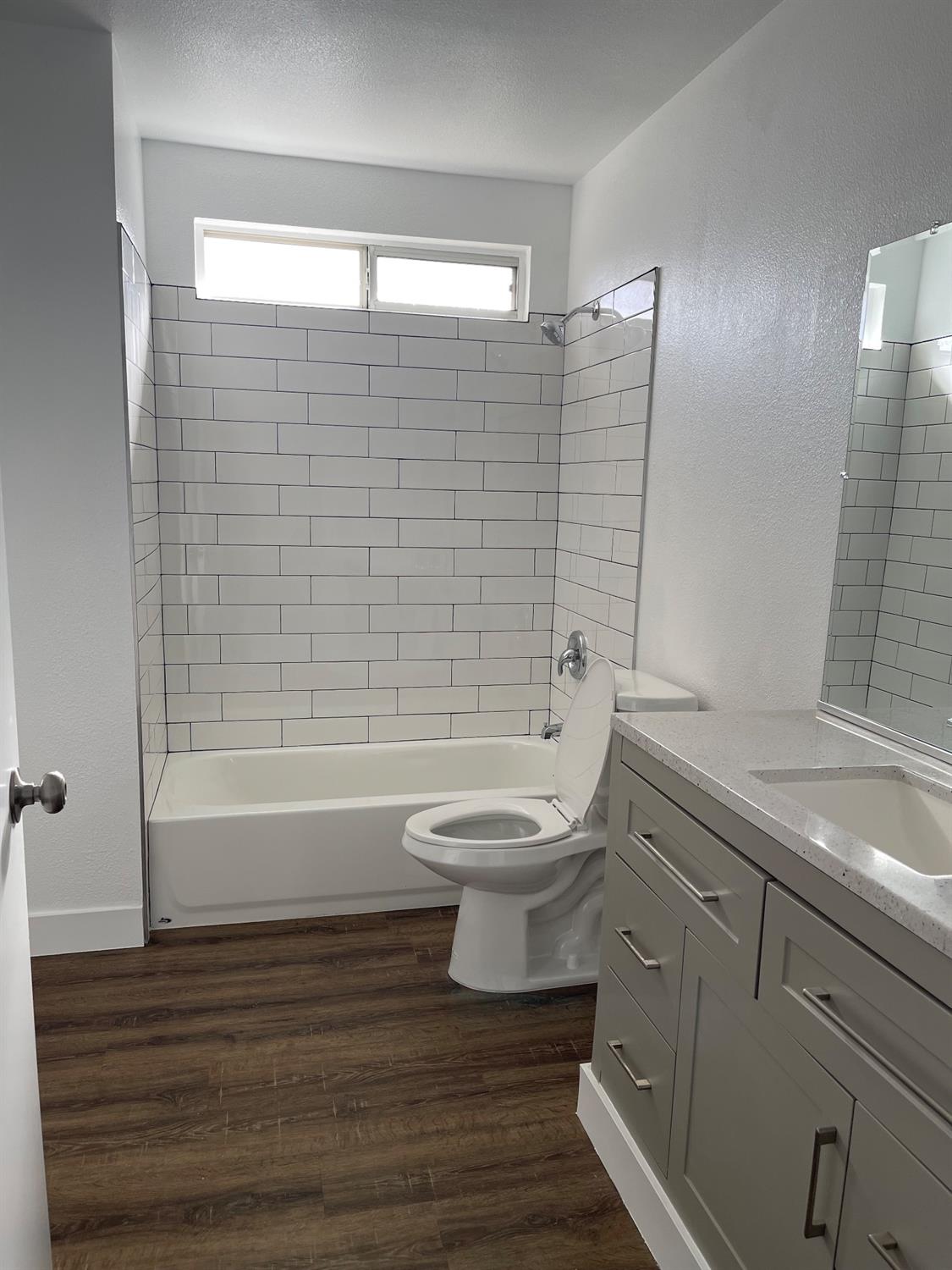 405 Fig Street Madera, CA 93638 - Photo 14 of 22 a bathroom with a sink a toilet and shower