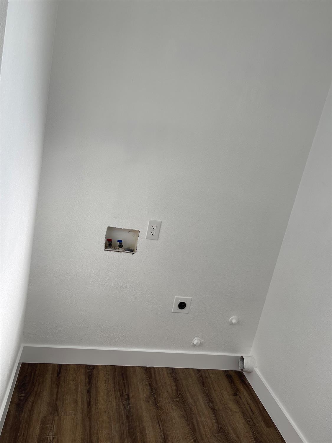 405 Fig Street Madera, CA 93638 - Photo 20 of 22 a view of room with wooden floor