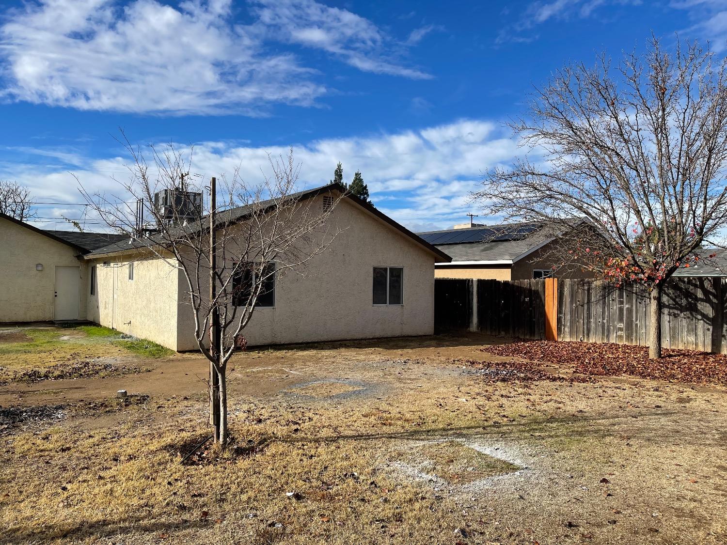405 Fig Street Madera, CA 93638 - Photo 5 of 22 a house with trees in the background