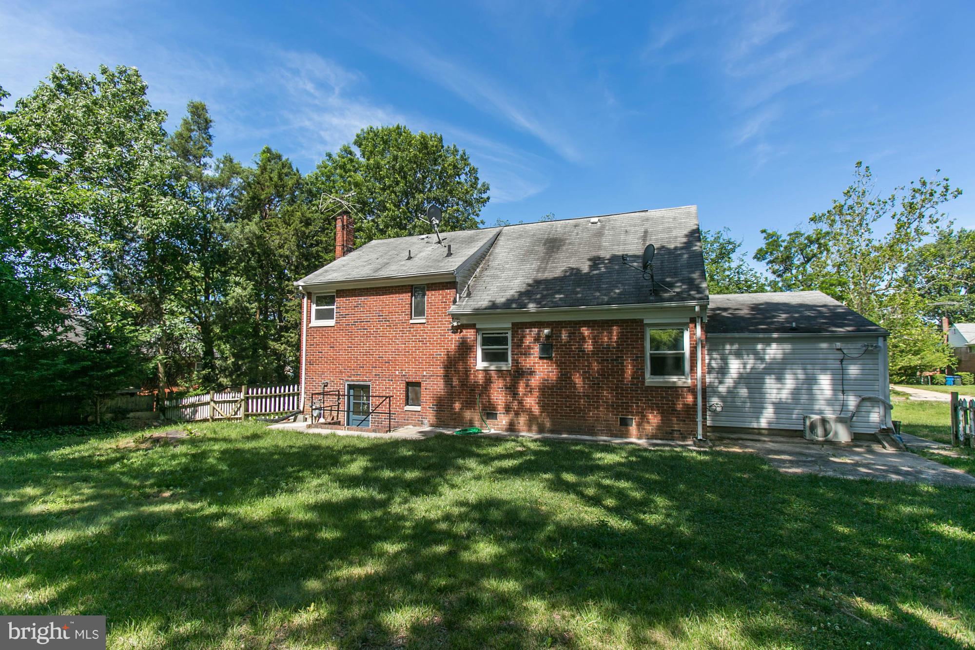 5815 Danbury Road Springfield, VA 22150 - Photo 2 of 27 a view of a house with backyard and a tree