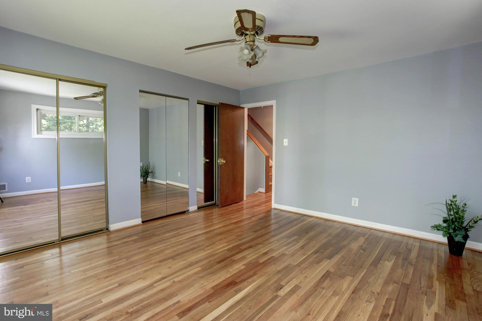 5815 Danbury Road Springfield, VA 22150 - Photo 16 of 27 wooden floor in an empty room with a window