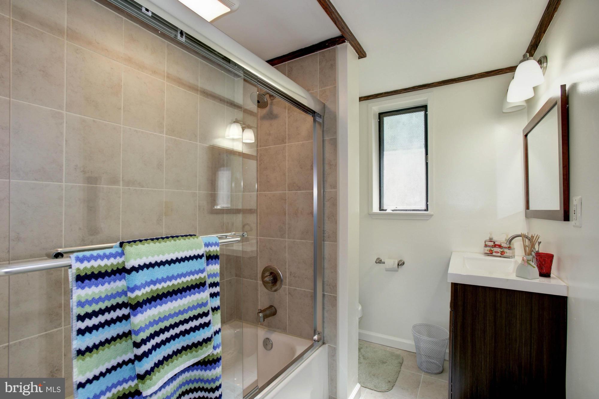 5815 Danbury Road Springfield, VA 22150 - Photo 18 of 27 a bathroom with a sink and a mirror