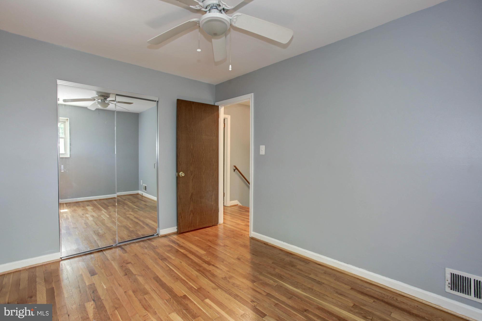 5815 Danbury Road Springfield, VA 22150 - Photo 21 of 27 a view of an empty room with wooden floor