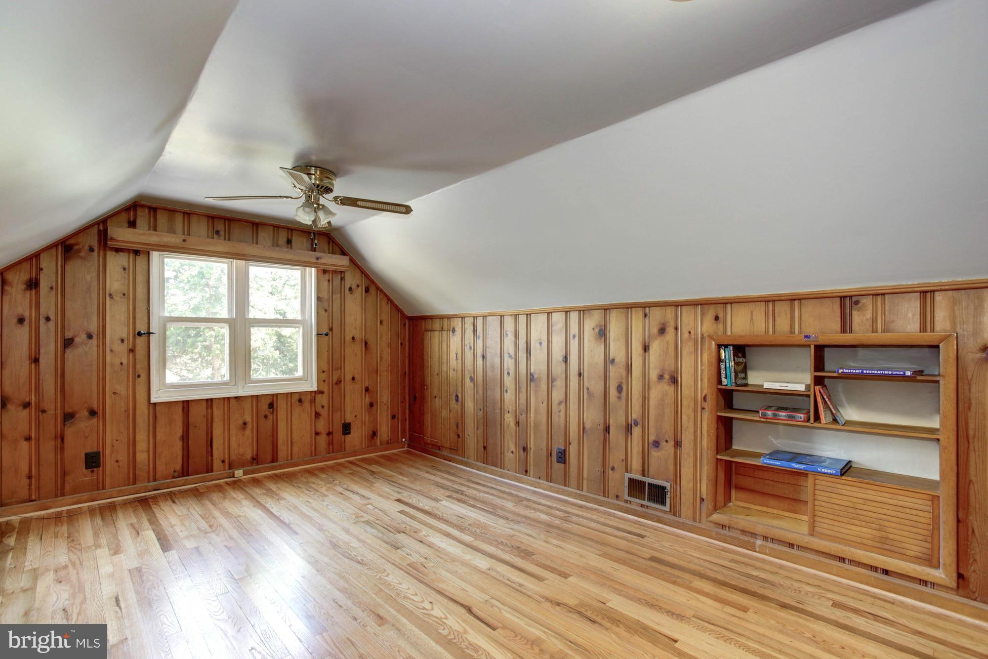5815 Danbury Road Springfield, VA 22150 - Photo 24 of 27 an empty room with wooden floor closet and windows