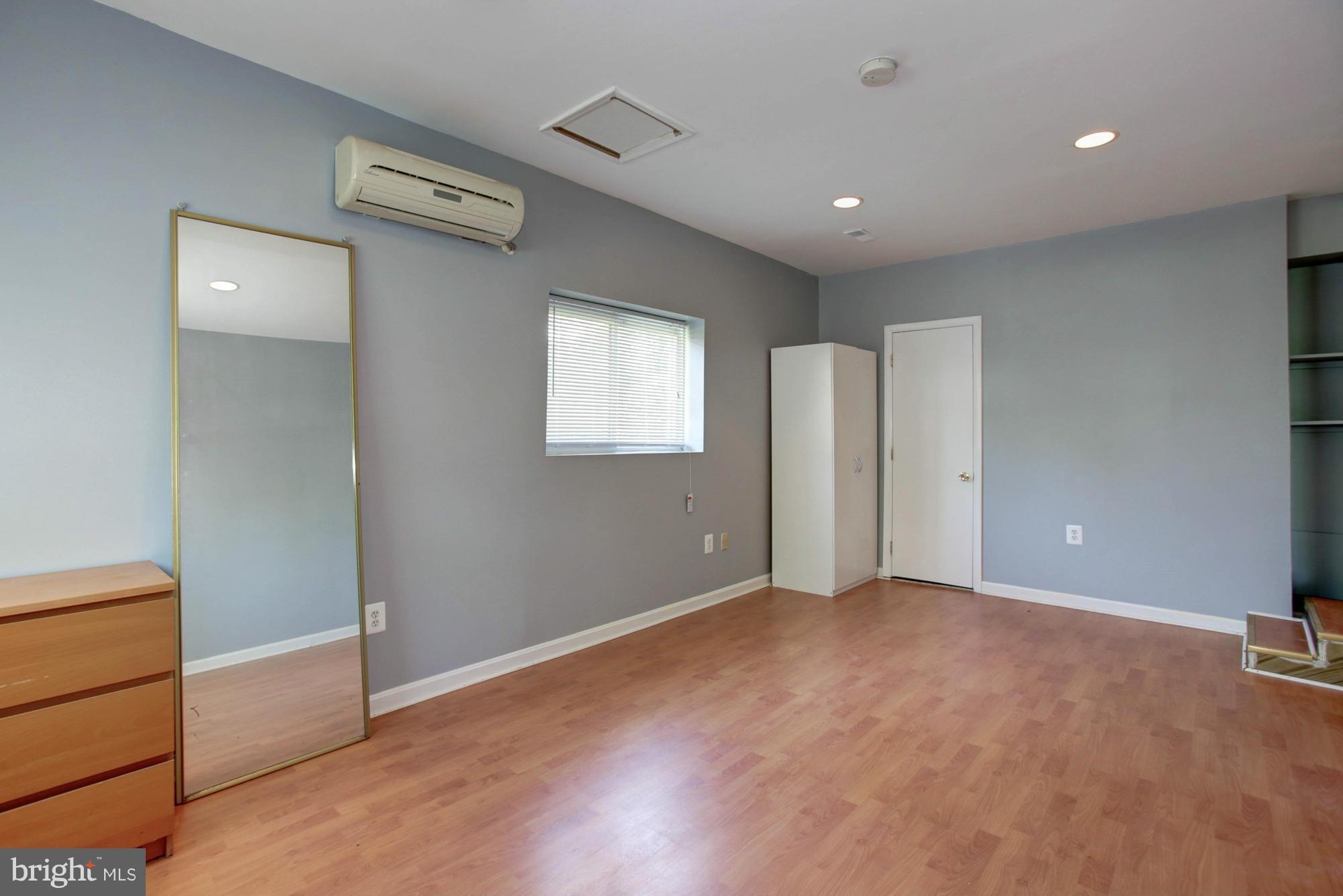 5815 Danbury Road Springfield, VA 22150 - Photo 10 of 27 a view of an empty room with a window