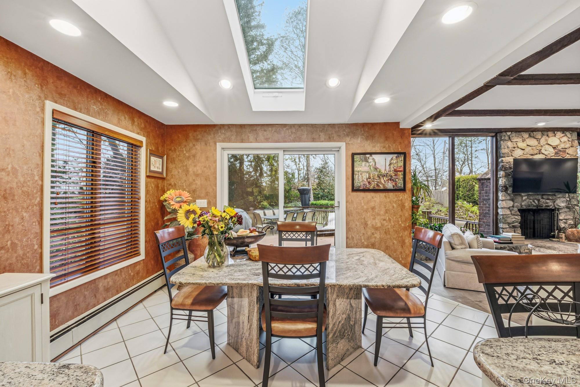 123 Robby Lane Manhasset Hills, NY 11040 - Photo 11 of 30 a dining room with furniture and large windows