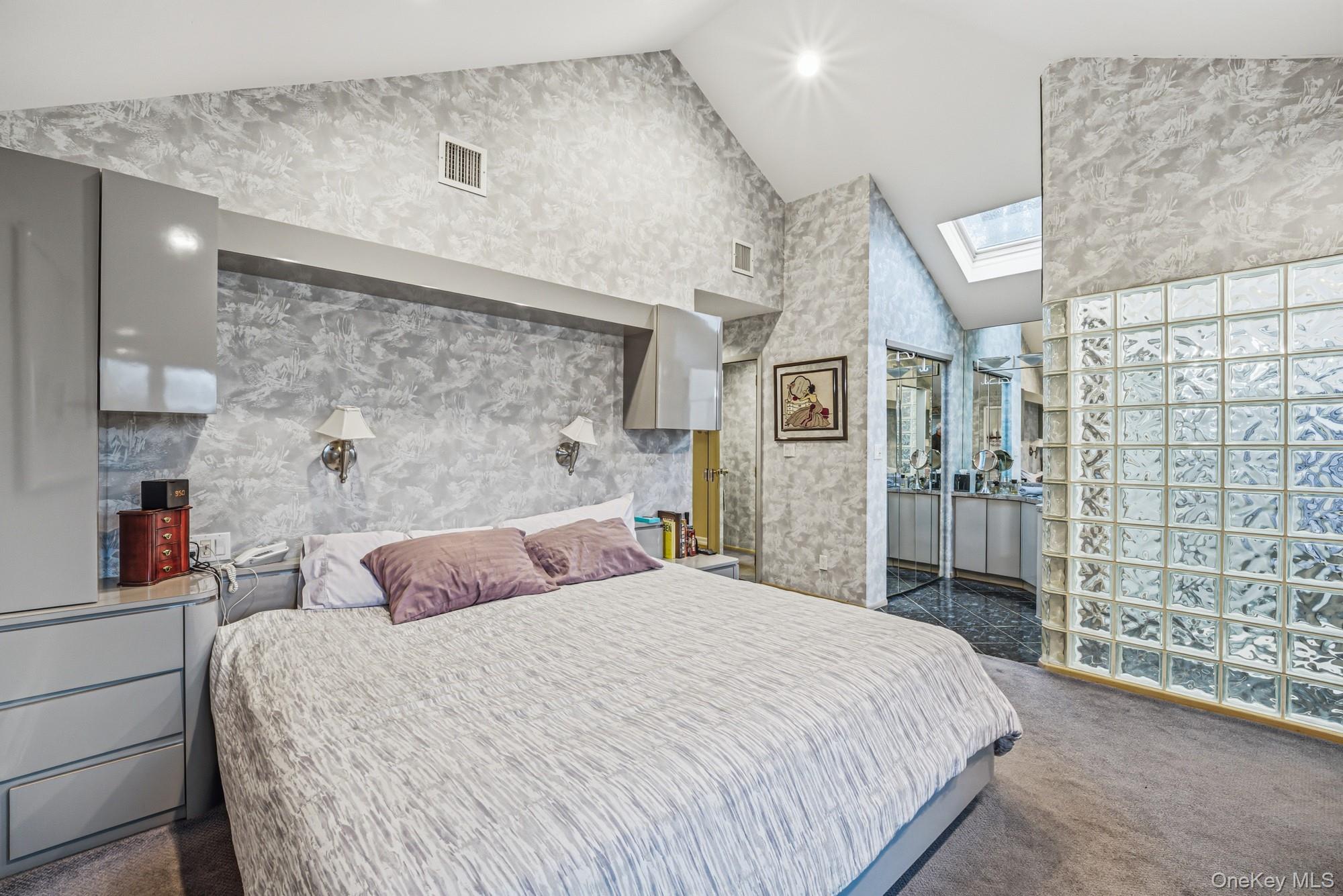 123 Robby Lane Manhasset Hills, NY 11040 - Photo 14 of 30 a bedroom with a bed and a cabinets