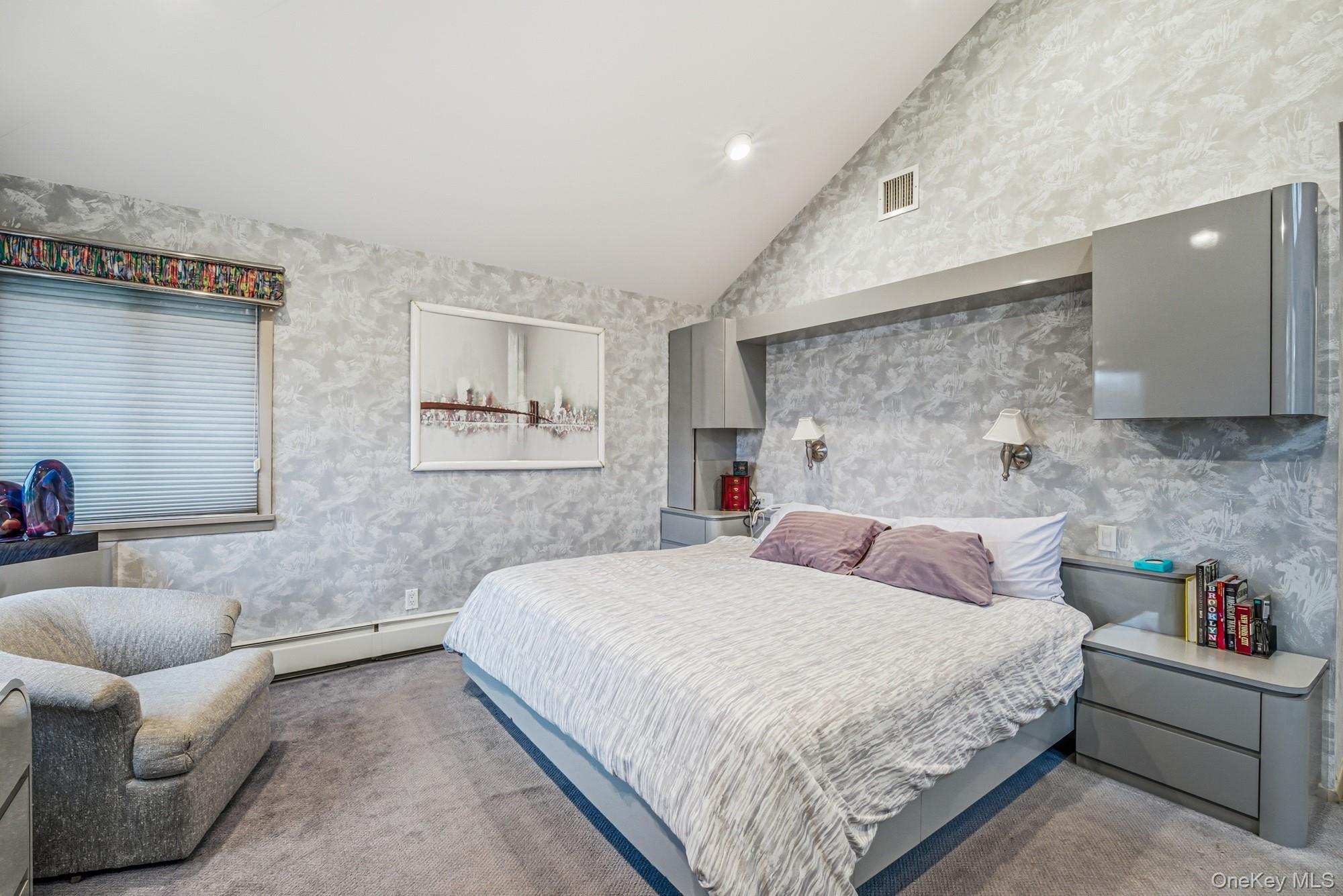 123 Robby Lane Manhasset Hills, NY 11040 - Photo 15 of 30 a bedroom with a bed and a couch