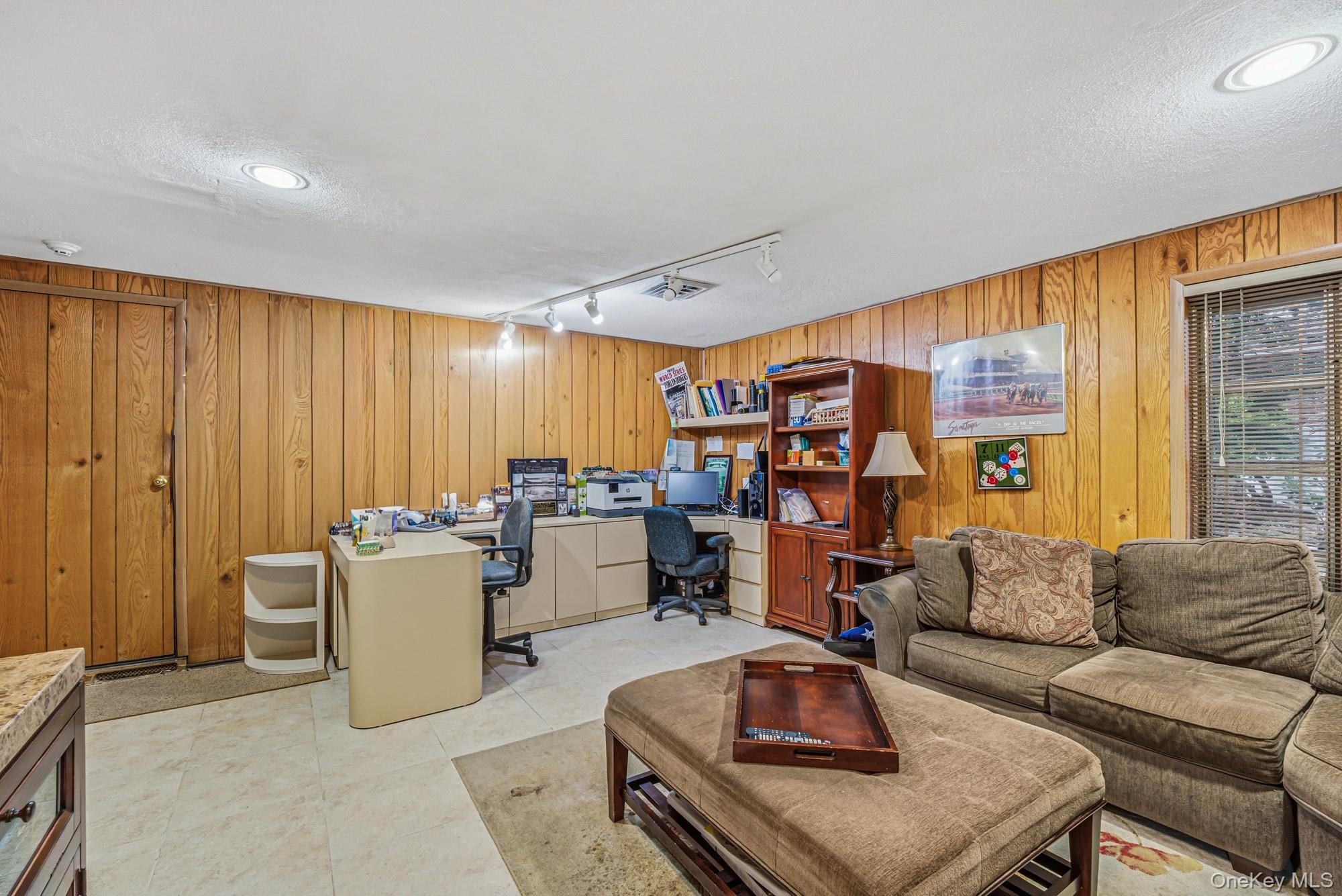 123 Robby Lane Manhasset Hills, NY 11040 - Photo 21 of 30 a living room with furniture and a large window
