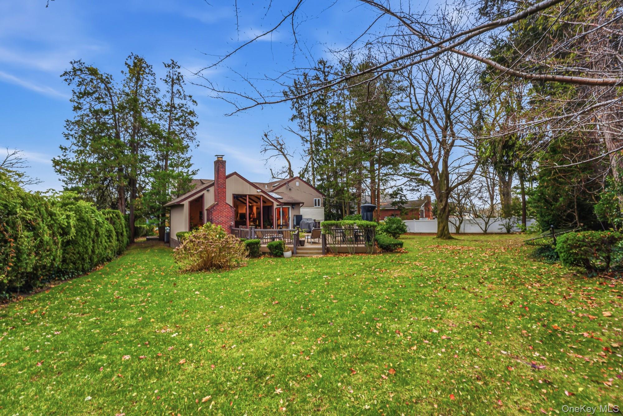 123 Robby Lane Manhasset Hills, NY 11040 - Photo 24 of 30 a view of a house with a yard