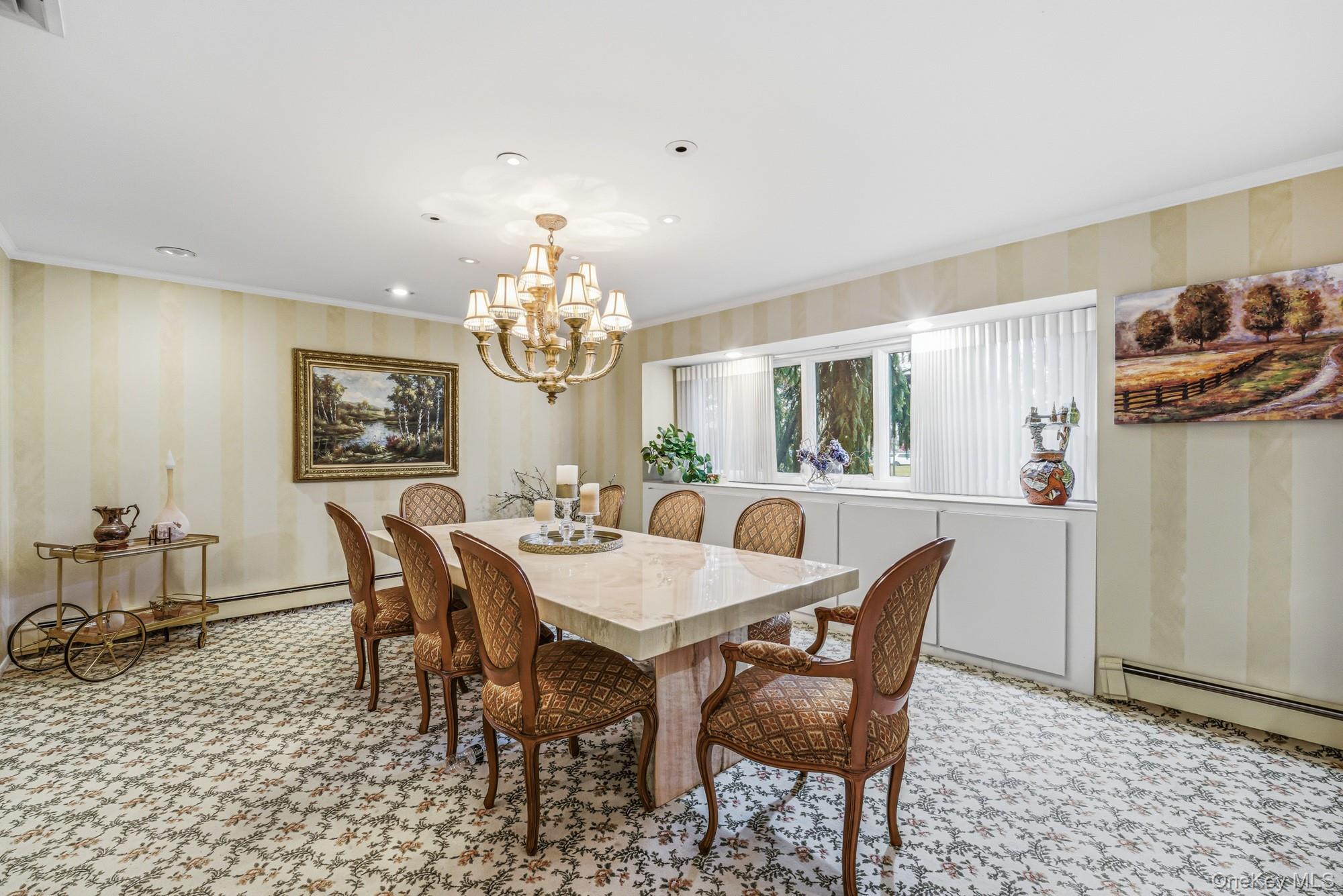 123 Robby Lane Manhasset Hills, NY 11040 - Photo 4 of 30 a view of a dining room with furniture and chandelier