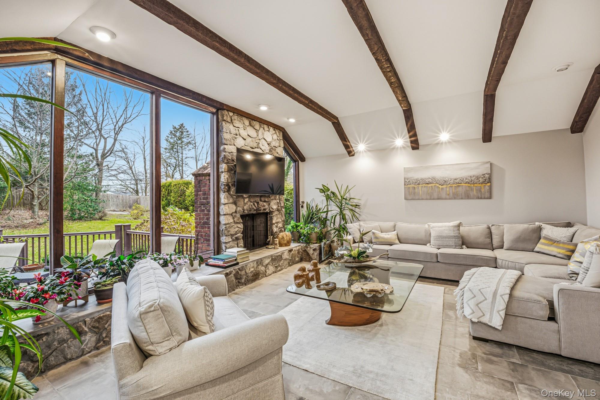 123 Robby Lane Manhasset Hills, NY 11040 - Photo 8 of 30 a living room with furniture and a large window