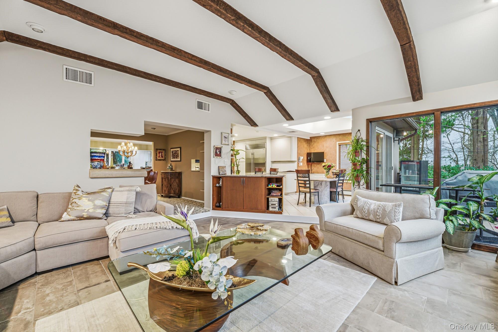 123 Robby Lane Manhasset Hills, NY 11040 - Photo 9 of 30 a living room with furniture and floor to ceiling windows