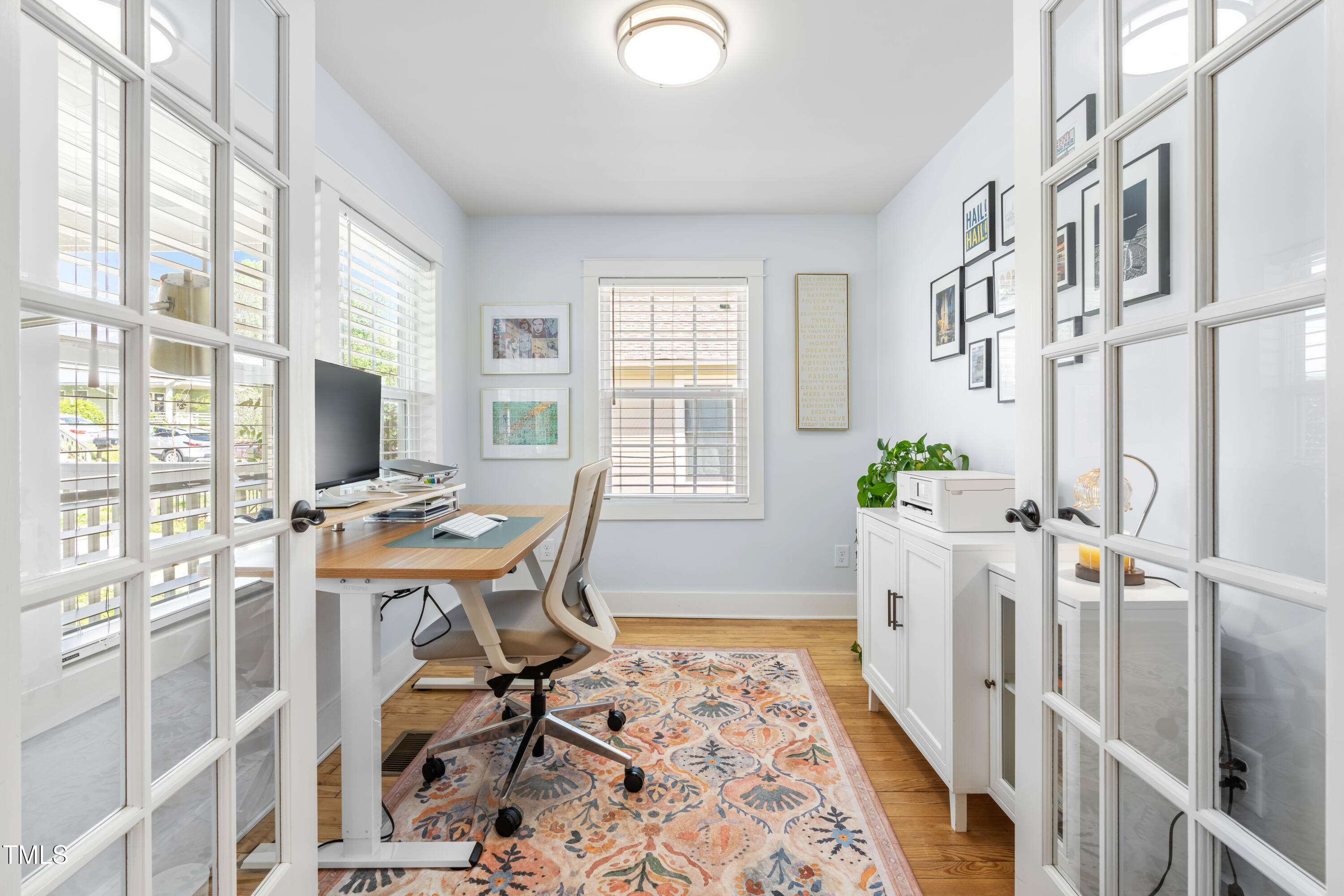1023 Kent Street Durham, NC 27707 - Photo 11 of 40 a view of a workspace with furniture and a window