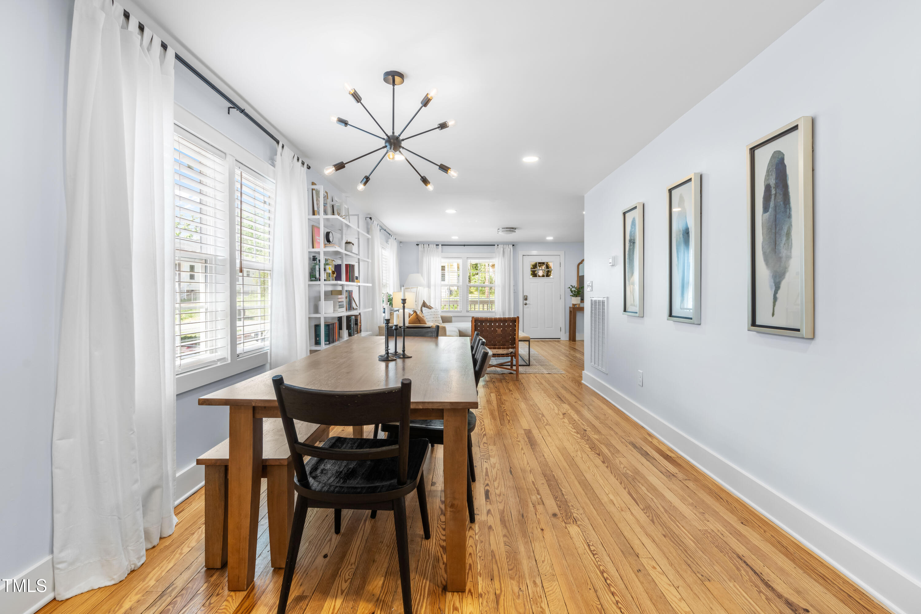 1023 Kent Street Durham, NC 27707 - Photo 14 of 40 a view of a dining room with furniture window and wooden floor