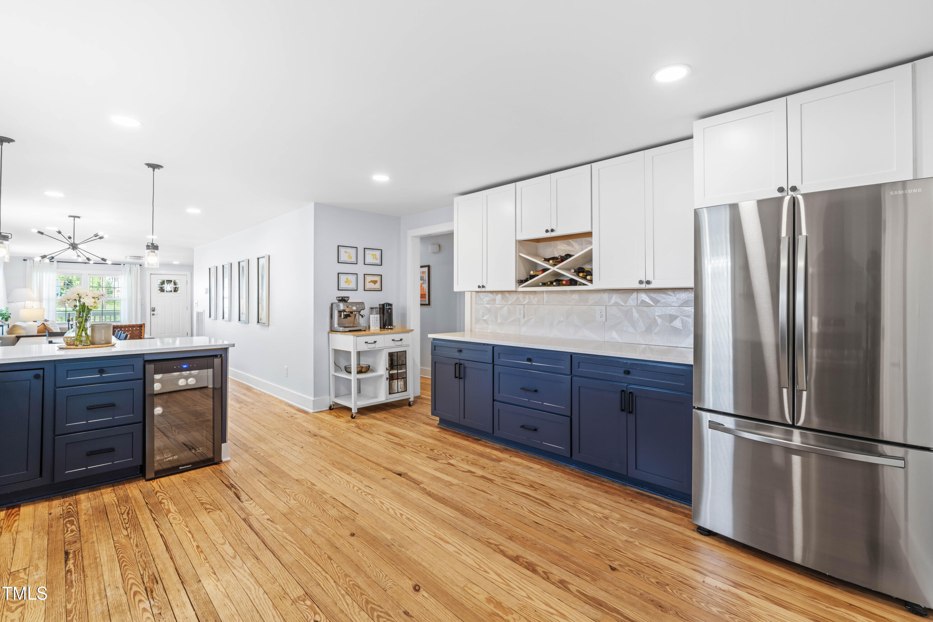 1023 Kent Street Durham, NC 27707 - Photo 20 of 40 a kitchen with stainless steel appliances granite countertop a refrigerator cabinets and wooden floor