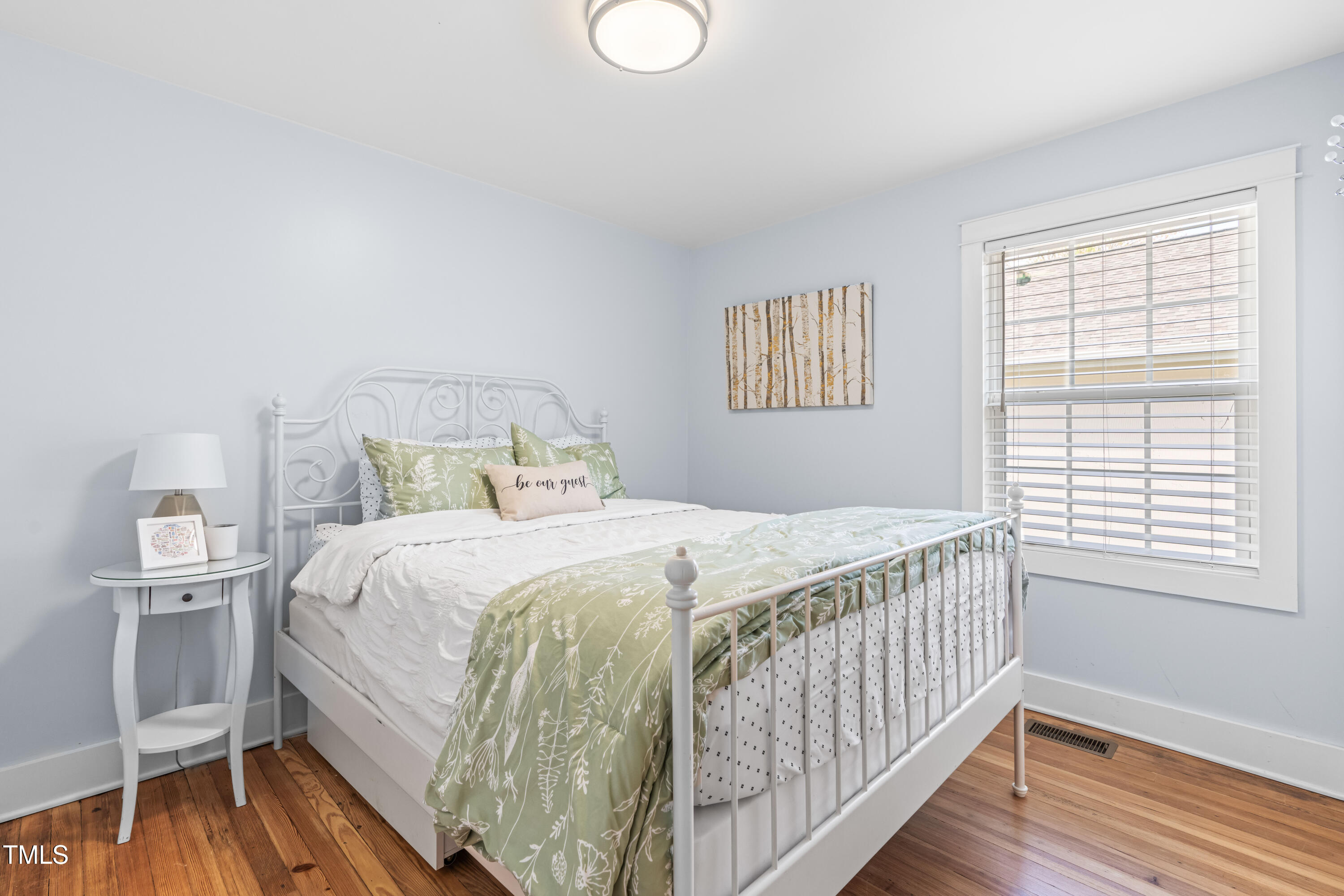 1023 Kent Street Durham, NC 27707 - Photo 21 of 40 a bedroom with a bed and a window