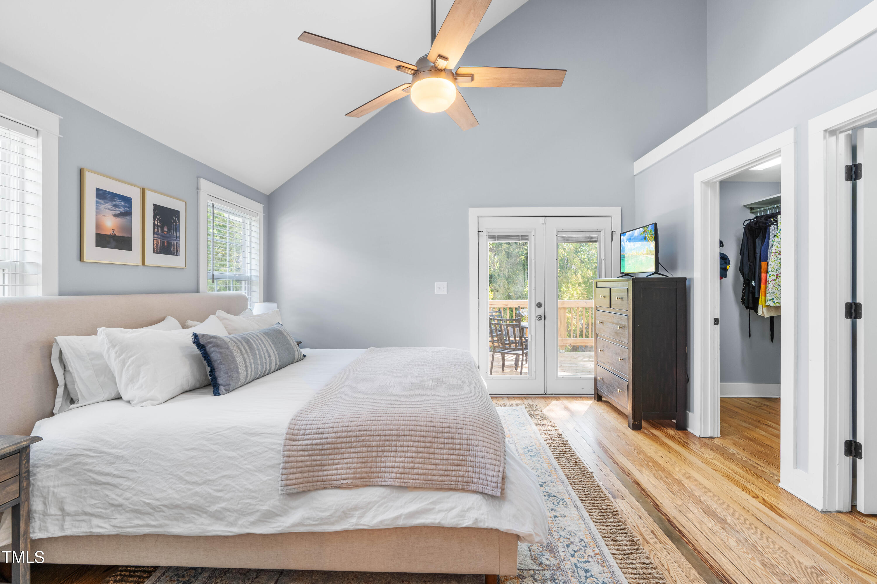 1023 Kent Street Durham, NC 27707 - Photo 29 of 40 a bedroom with a large bed and a large window