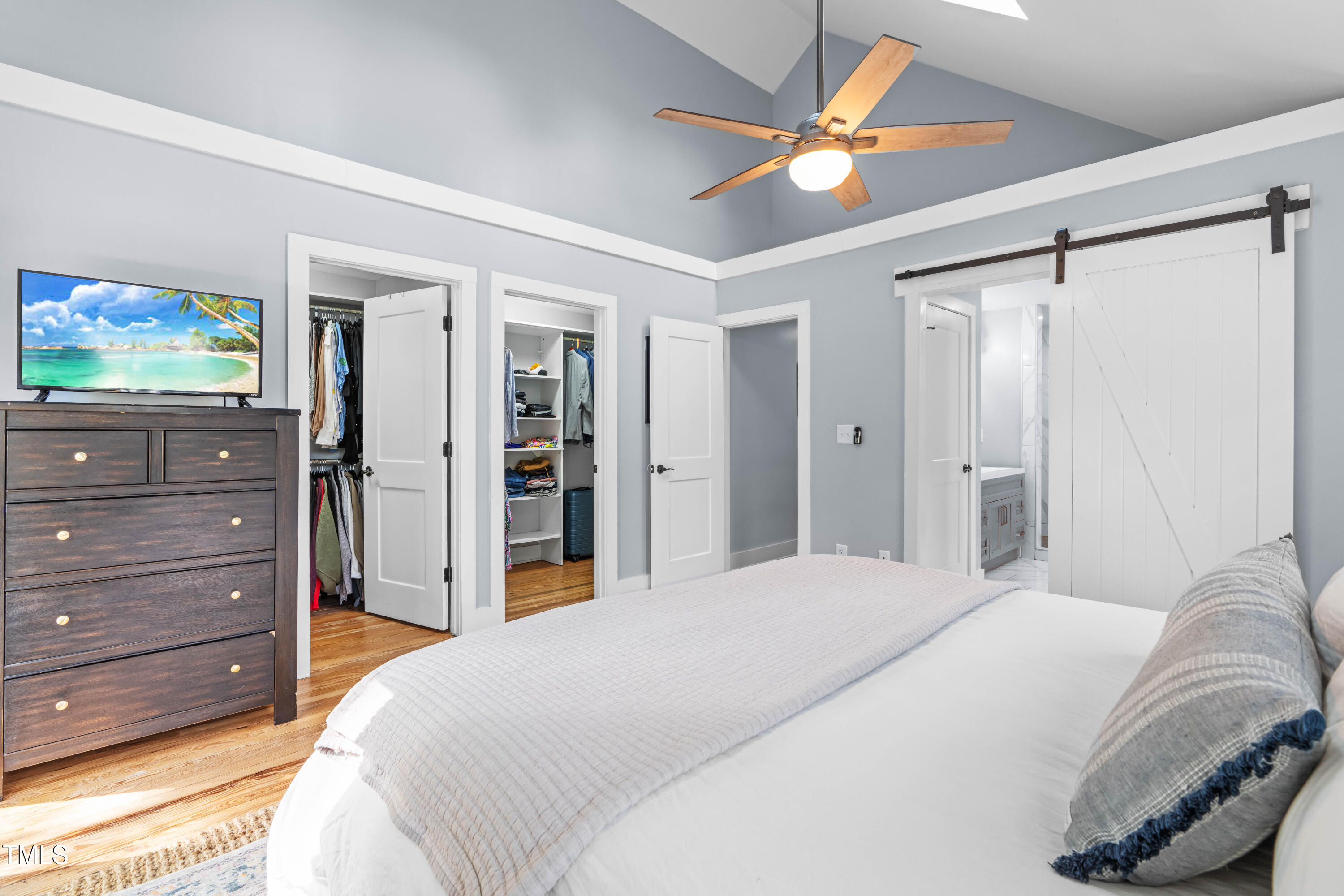 1023 Kent Street Durham, NC 27707 - Photo 30 of 40 a bedroom with a bed and a mirror on dresser