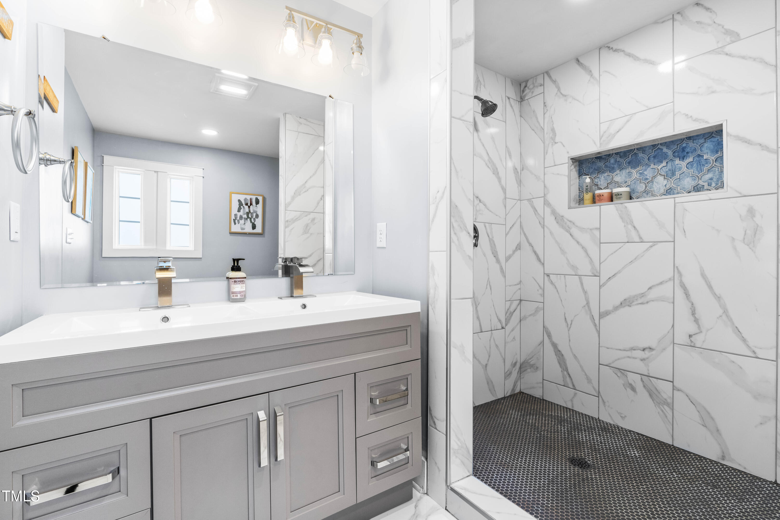 1023 Kent Street Durham, NC 27707 - Photo 31 of 40 a spacious bathroom with a shower and a sink