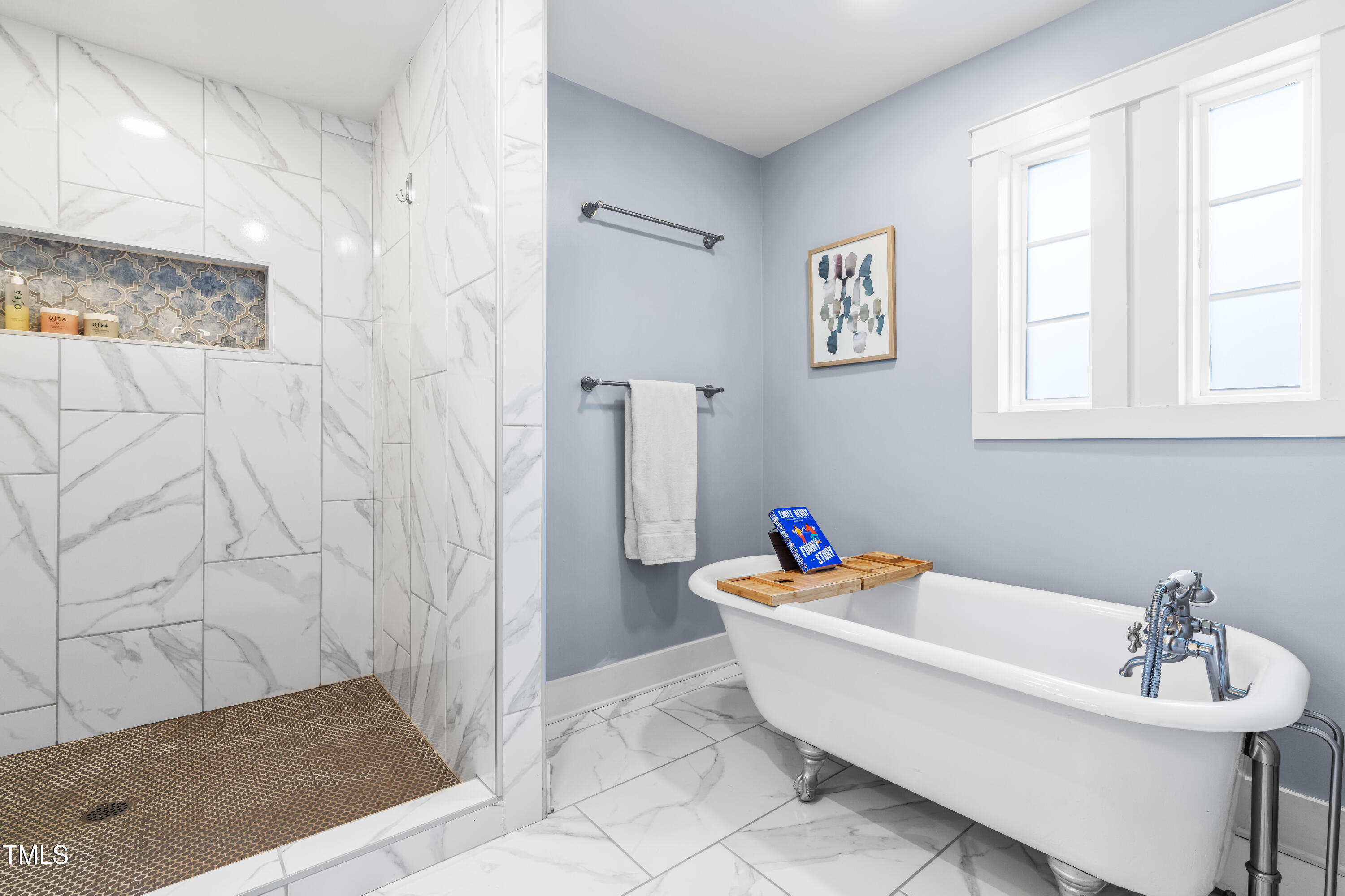 1023 Kent Street Durham, NC 27707 - Photo 32 of 40 a bathroom with a bath tub a sink and a window