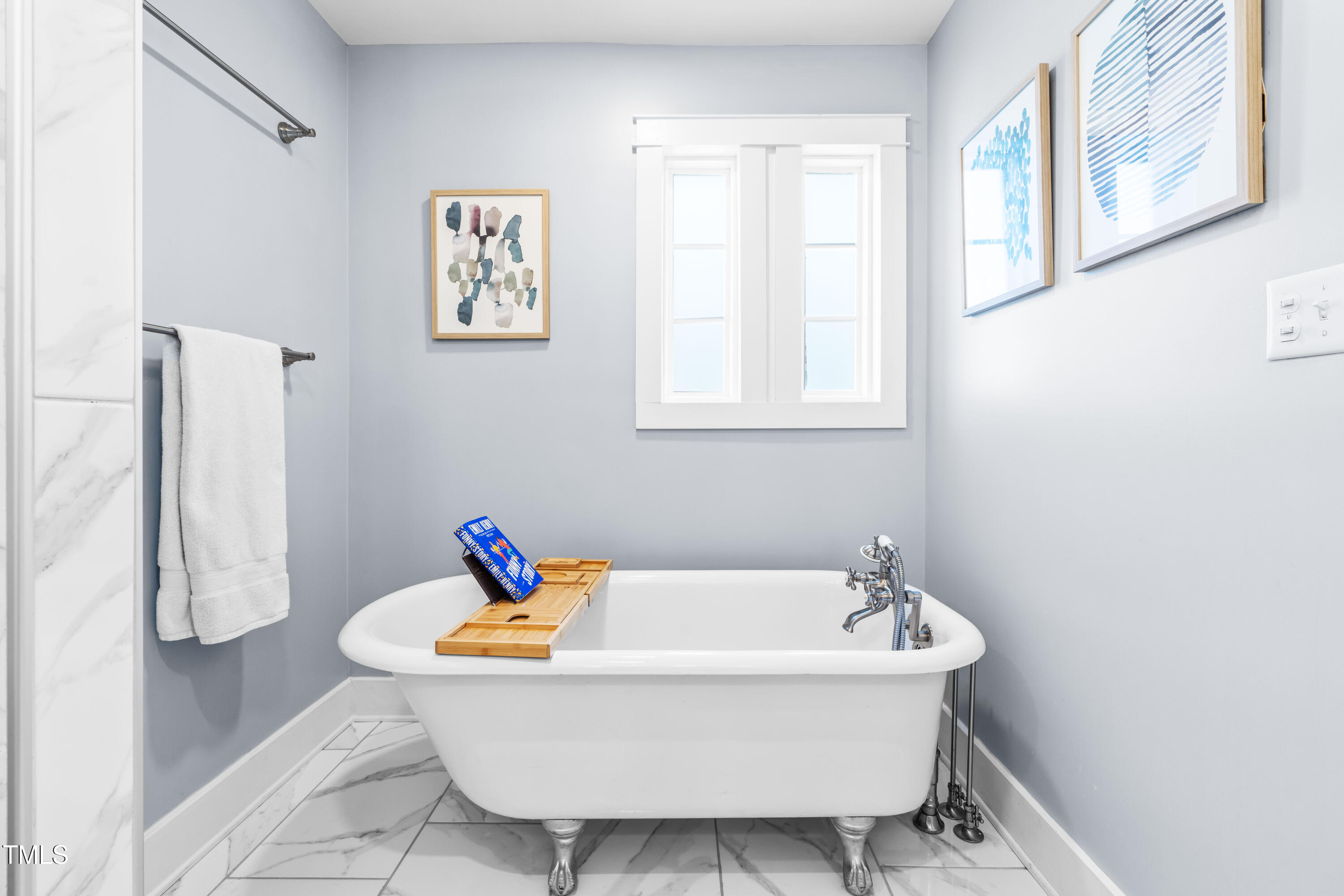 1023 Kent Street Durham, NC 27707 - Photo 33 of 40 a white bath tub sitting next to a bathroom