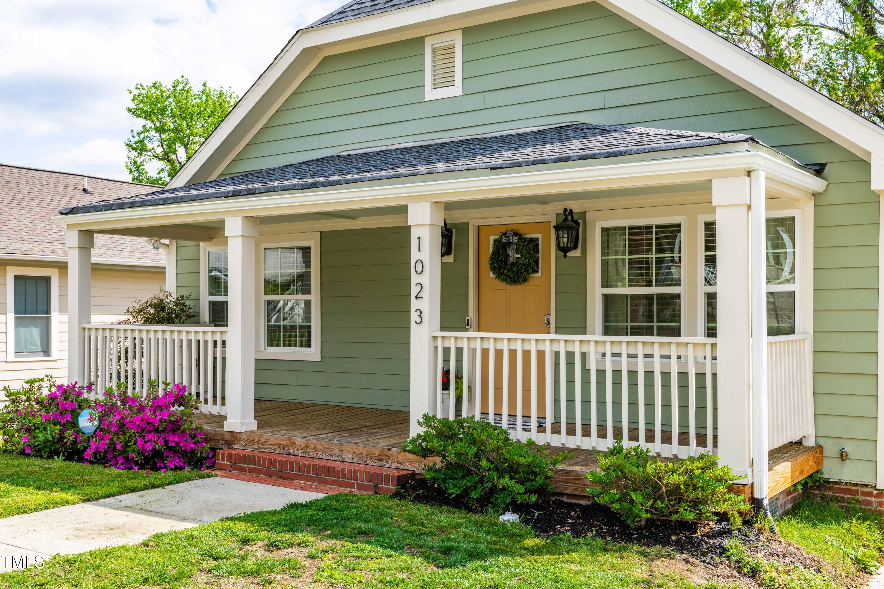 1023 Kent Street Durham, NC 27707 - Photo 3 of 40 a view of a house with yard and a garden