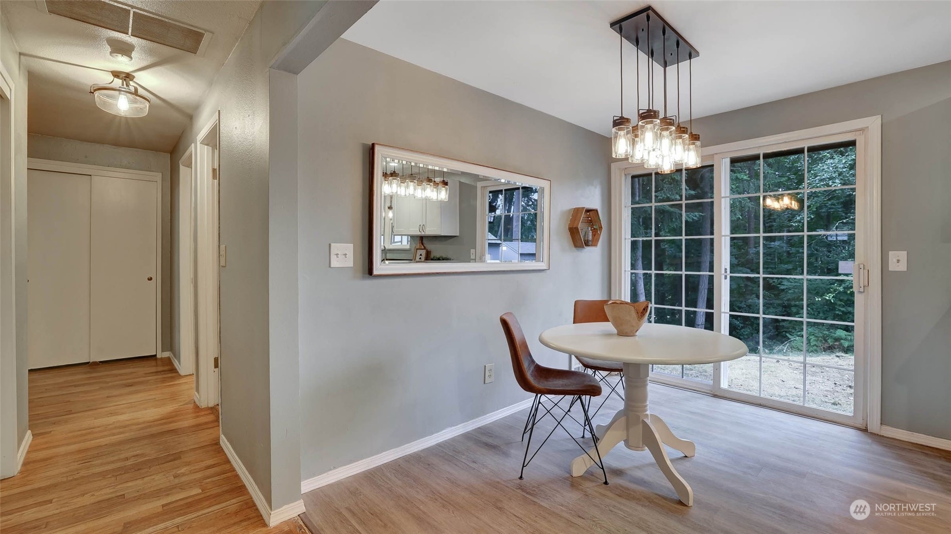 14333 165th Place Southeast Renton, WA 98059 - Photo 14 of 36 a view of a dining room with furniture wooden floor and chandelier