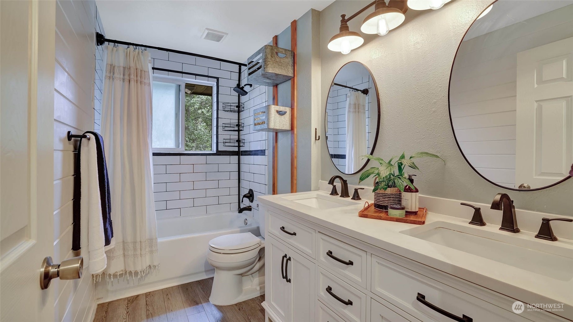 14333 165th Place Southeast Renton, WA 98059 - Photo 20 of 36 a bathroom with a toilet a sink and a mirror