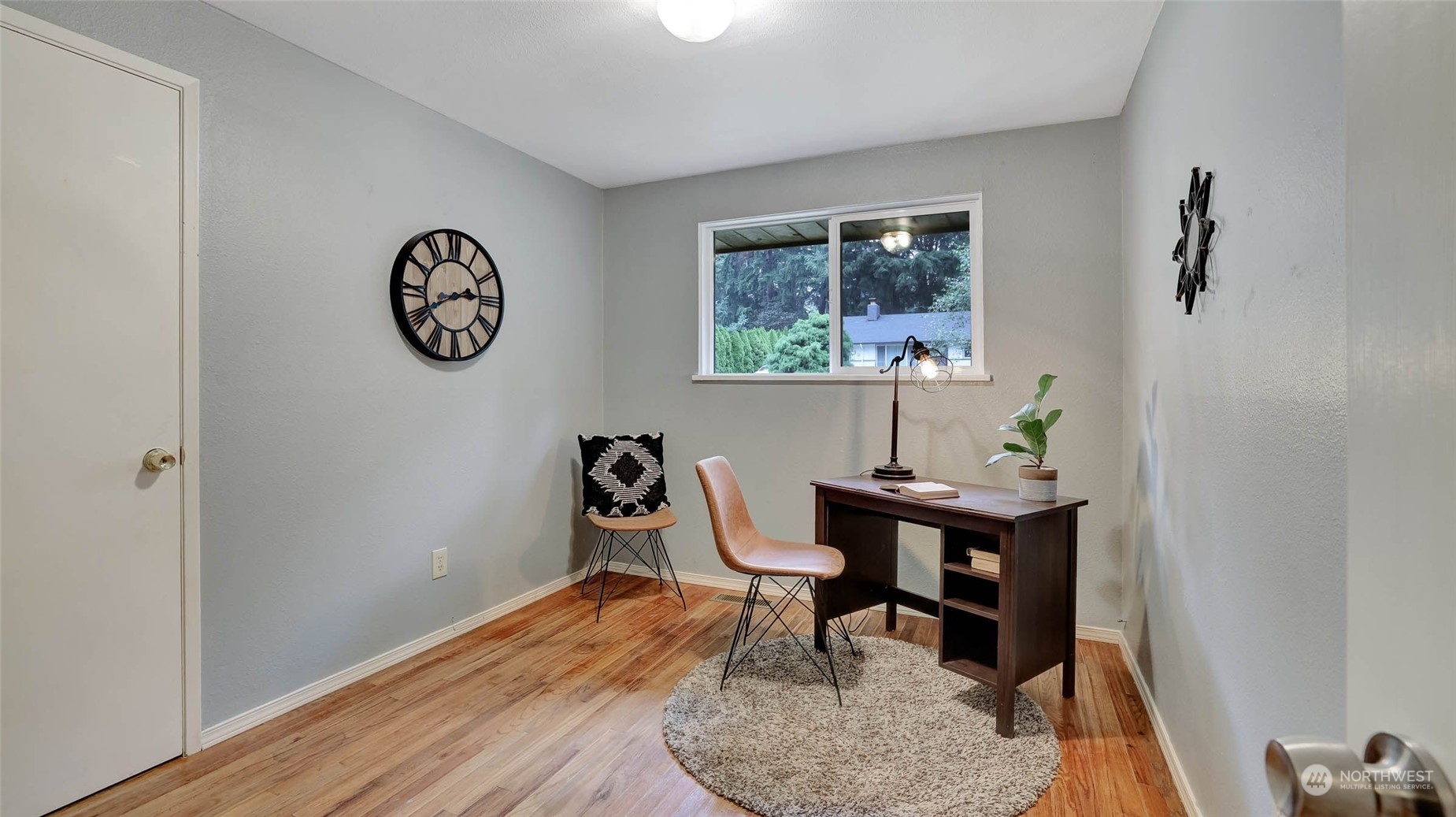 14333 165th Place Southeast Renton, WA 98059 - Photo 22 of 36 a view of a workspace with furniture and wooden floor