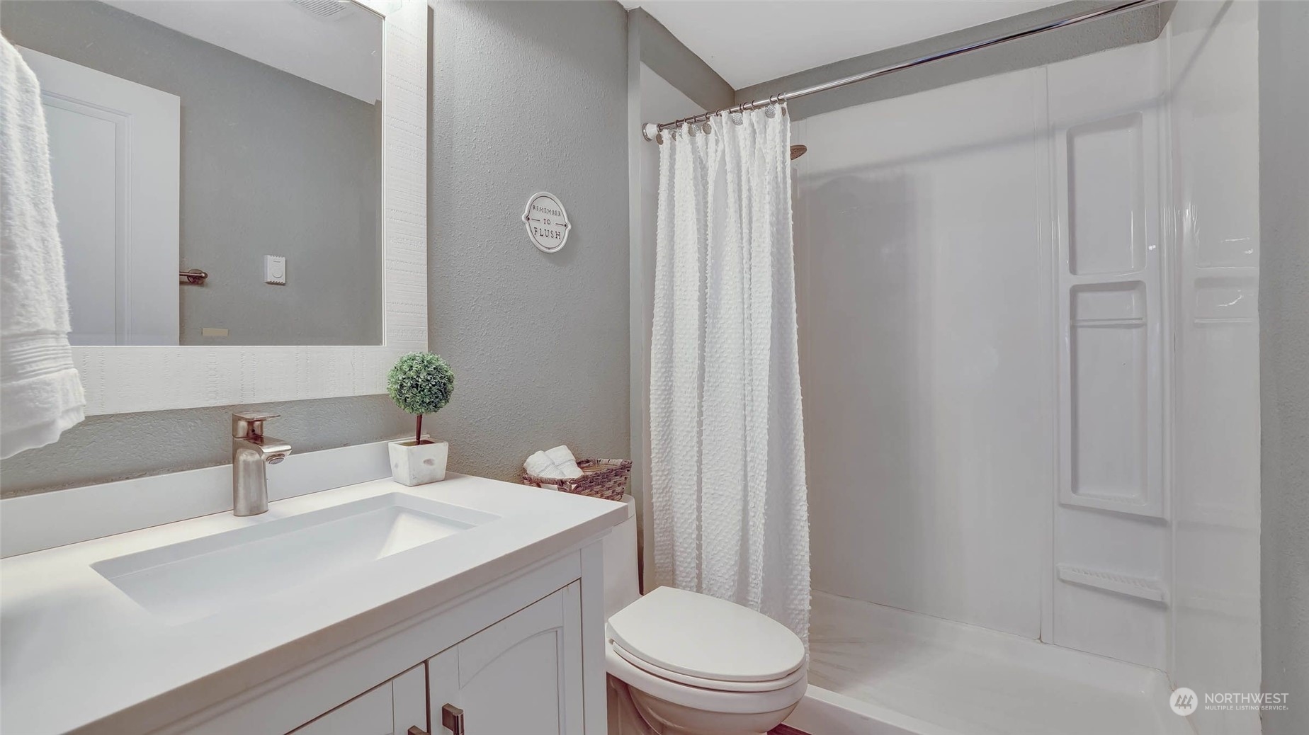 14333 165th Place Southeast Renton, WA 98059 - Photo 23 of 36 a bathroom with a sink toilet and shower