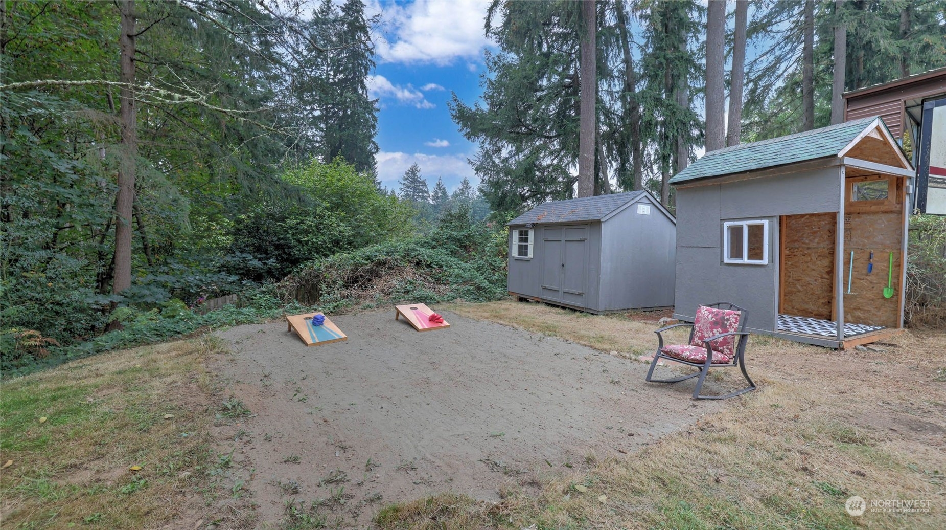 14333 165th Place Southeast Renton, WA 98059 - Photo 27 of 36 a wooden bench sitting in front of a house