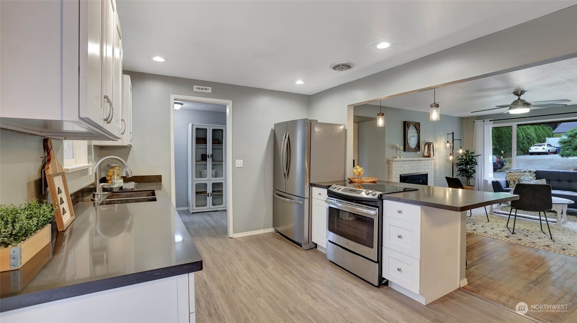 14333 165th Place Southeast Renton, WA 98059 - Photo 10 of 36 a kitchen with stainless steel appliances granite countertop a stove and a refrigerator