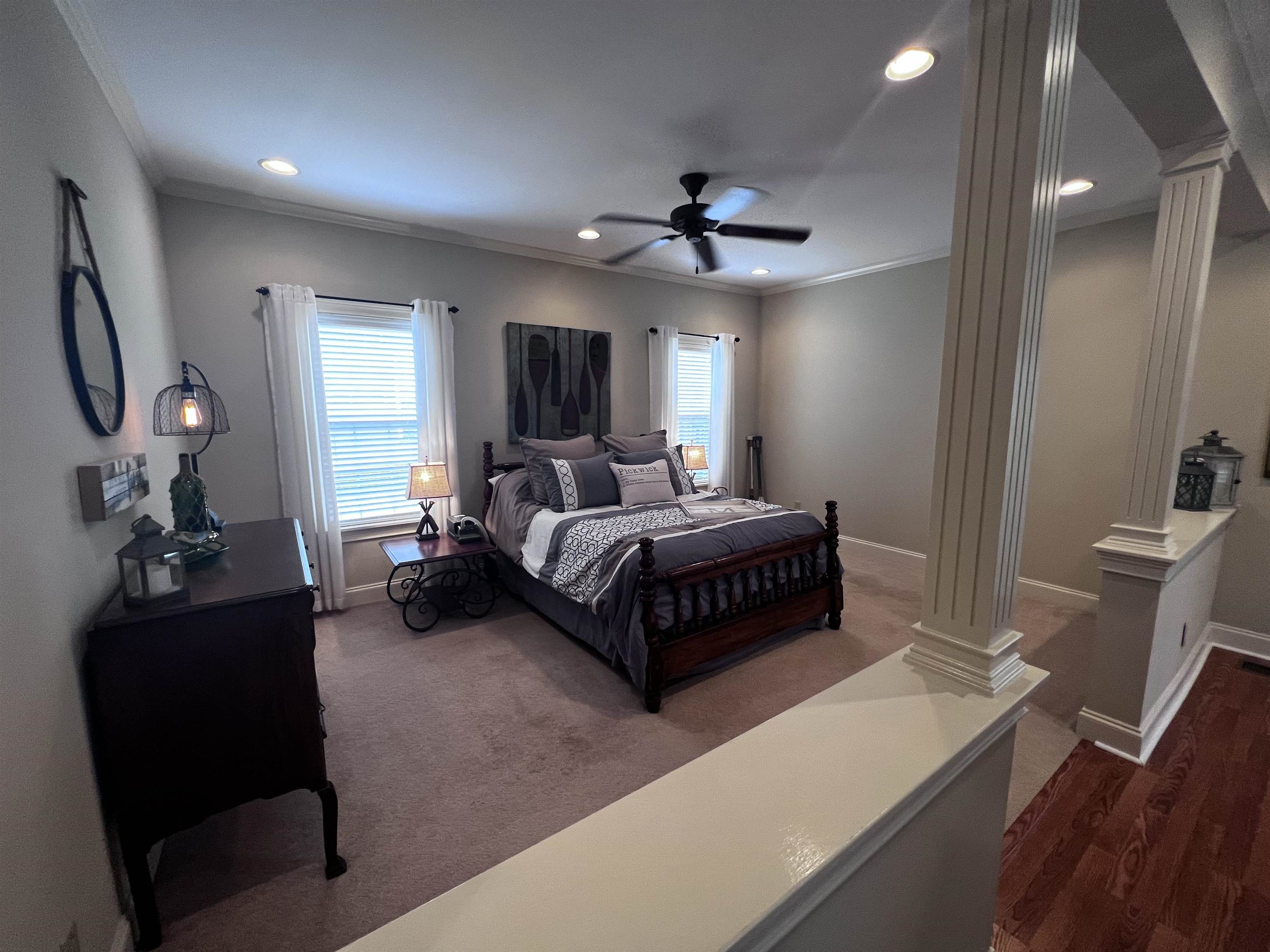 16 Jennifer Junction Iuka, MS 38852 - Photo 14 of 36 a bedroom with a bed and a chandelier